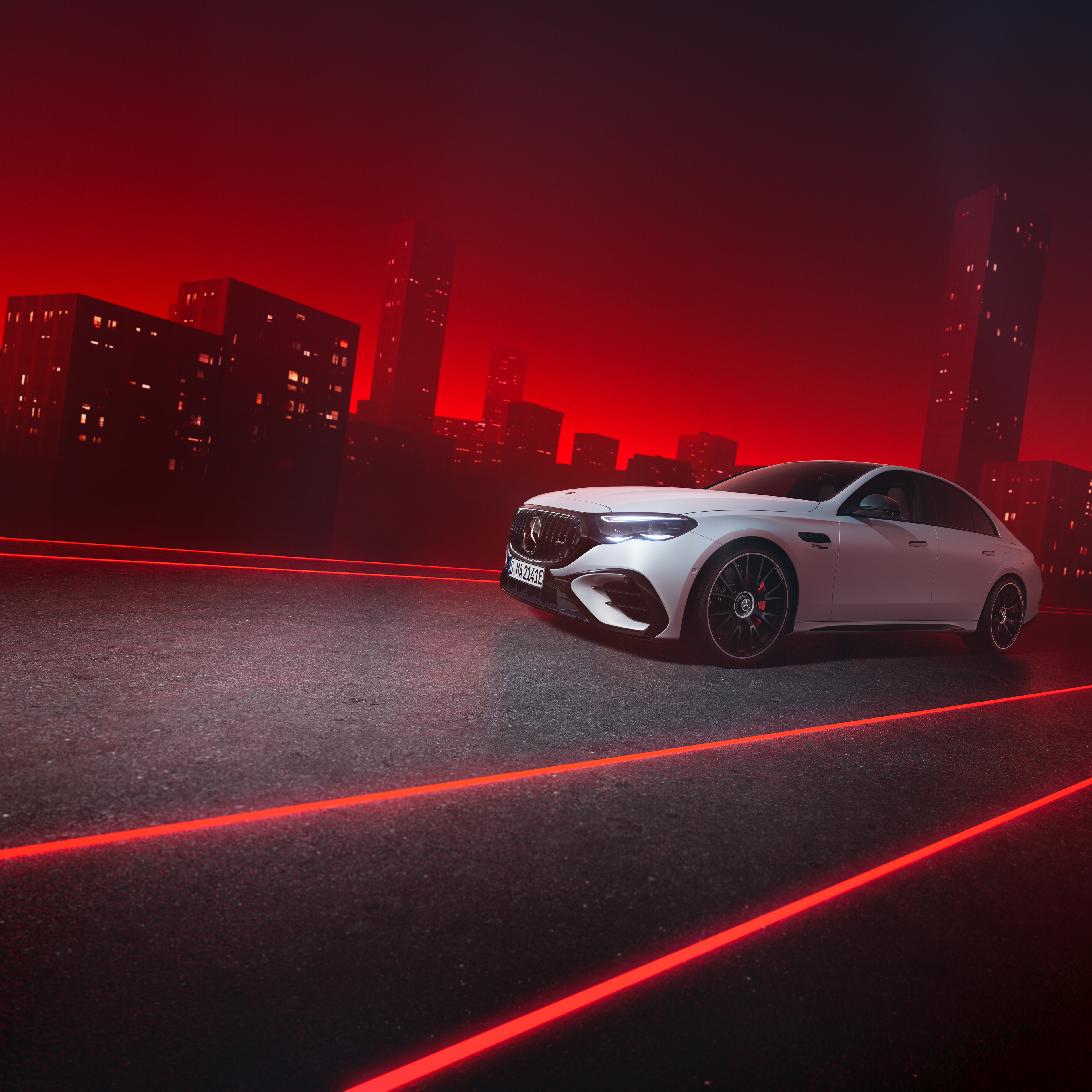 E-Klass Sedan AMG Performance Edition | Tjänstebilar | Mercedes-AMG Vit Mercedes-AMG E-Klass Sedan kör på väg i storstad