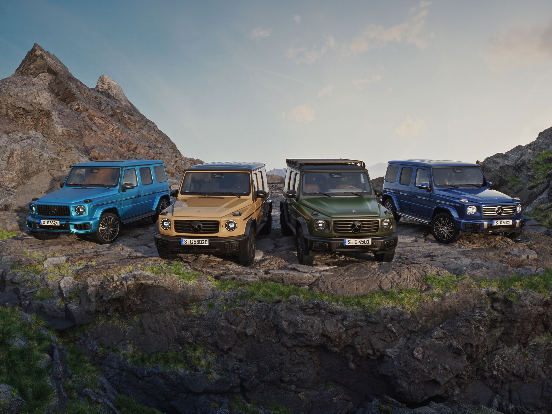 Mercedes-Benz G-Klass SUV:ar i flera färger på bergsterräng.